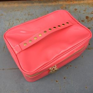 Neon pink Nicki Minaj travel case
